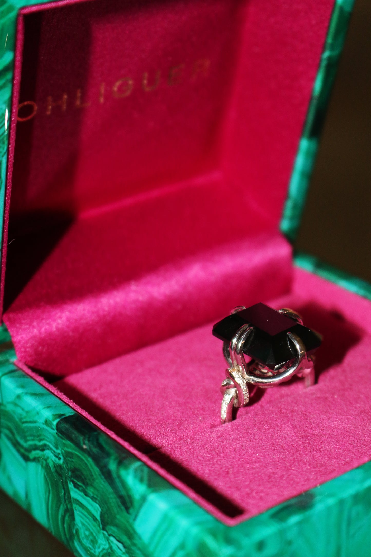 Forget Me Knot Onyx ring with Diamonds in 18ct white gold