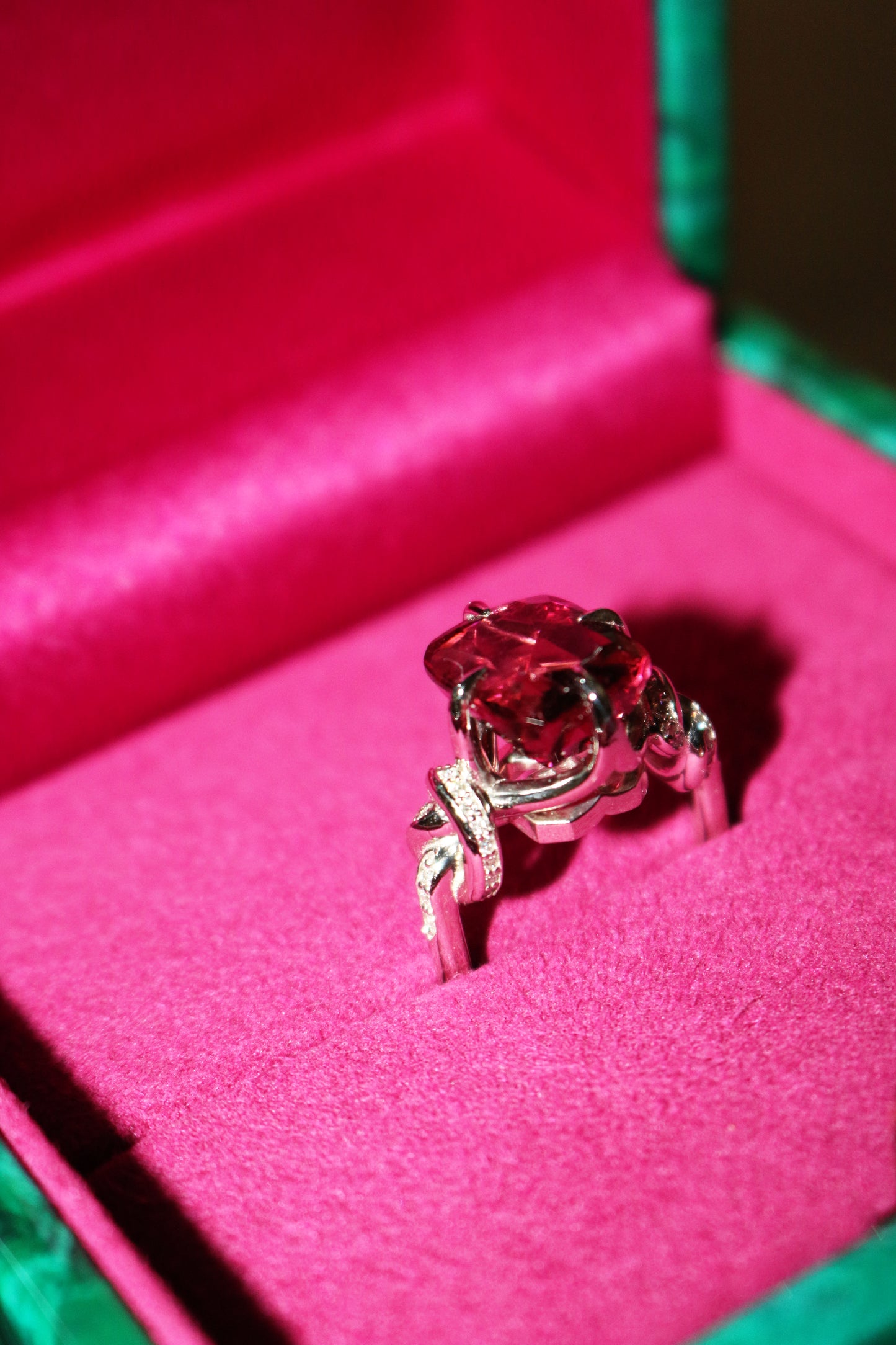 Forget Me Knot Emerald Cut Rubelite ring in platinum and diamonds