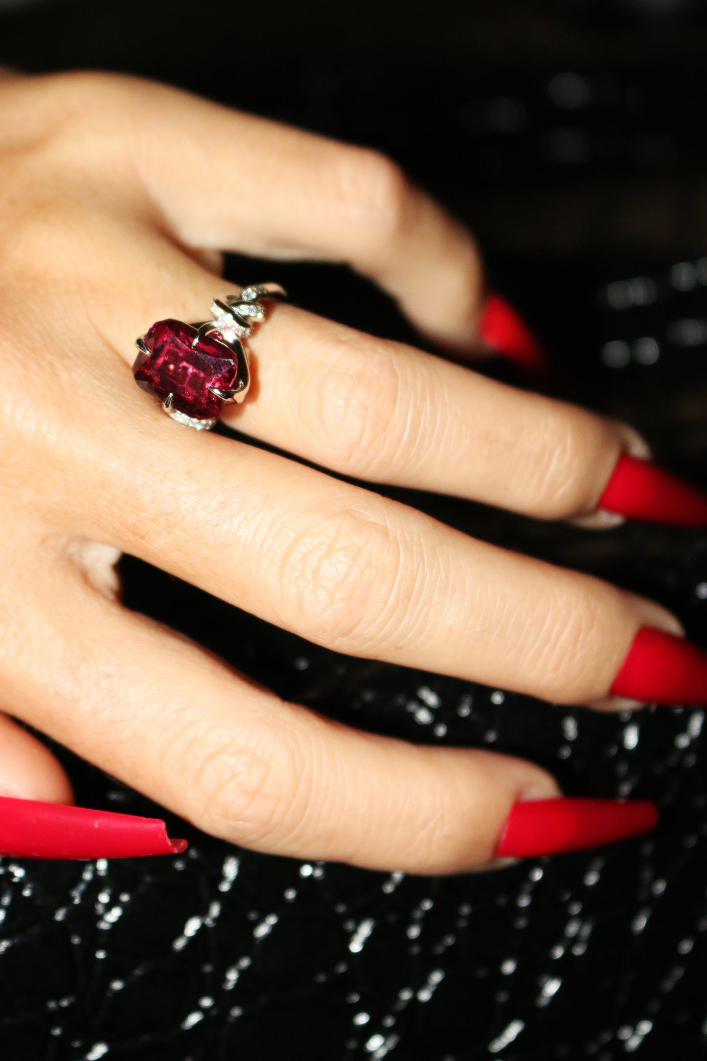 Forget Me Knot Emerald Cut Rubelite ring in platinum and diamonds