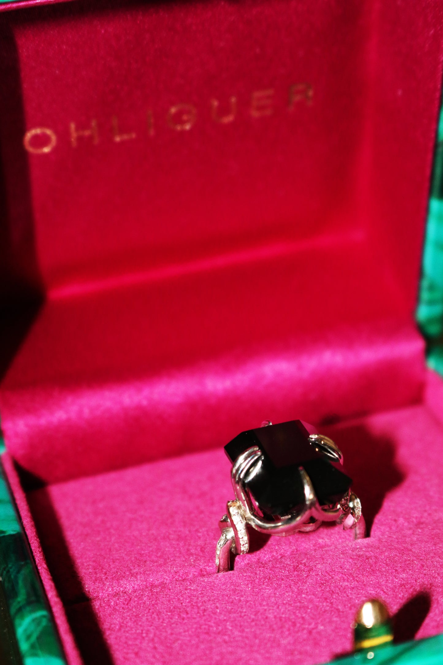 Forget Me Knot Onyx ring with Diamonds in 18ct white gold