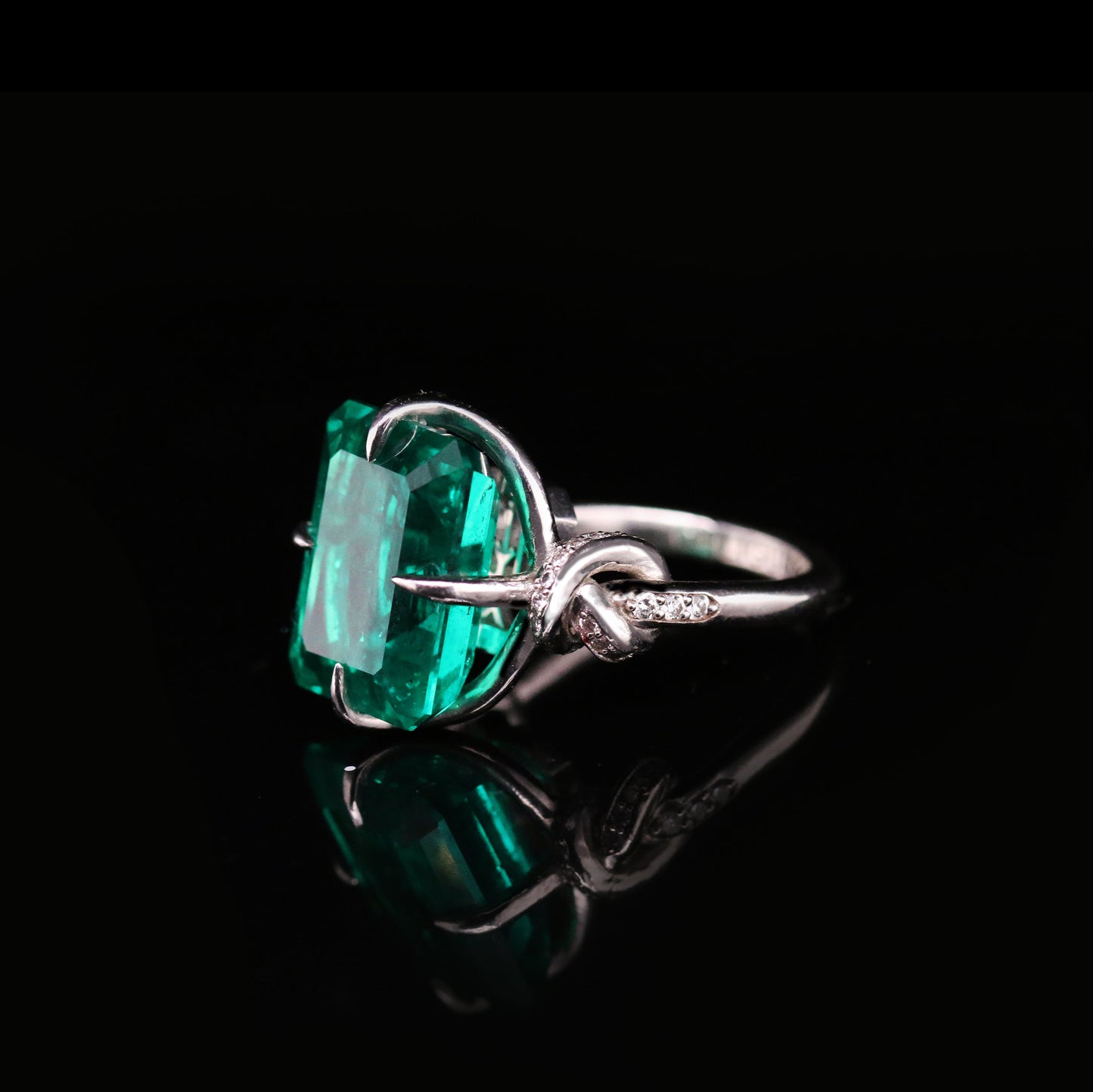 One of a Kind 8ct Forget Me Knot Emerald ring with Diamonds in Platinum