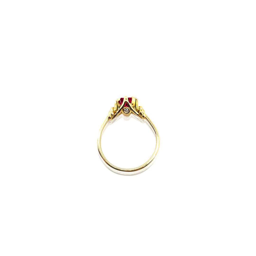 Oval Cut Ruby in Reef Knot ring in 18ct Yellow Gold