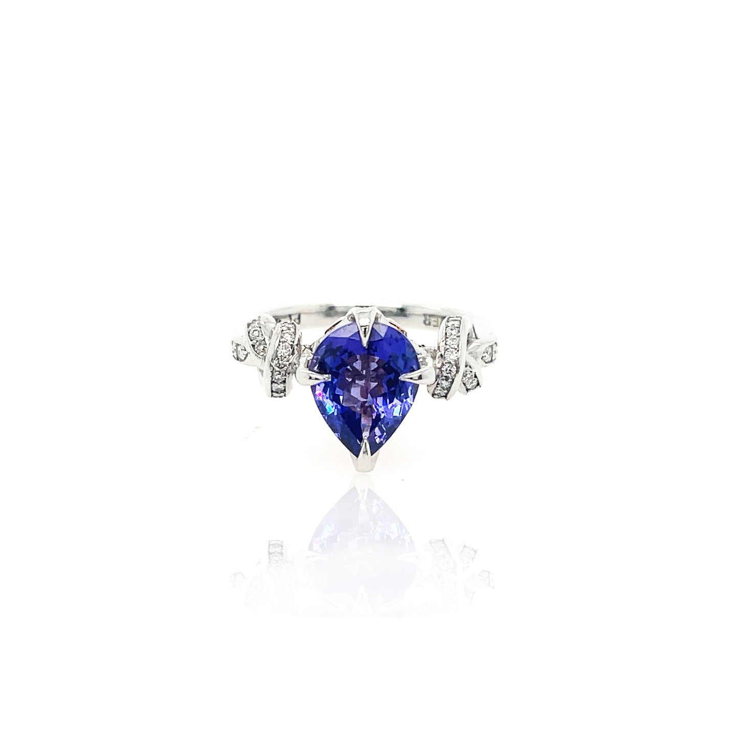 Pear Cut Tanzanite Forget Me Knot ring in platinum and rose gold