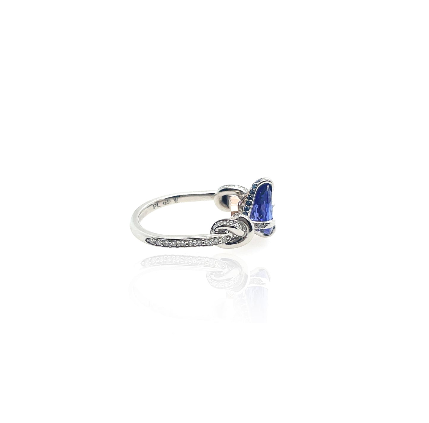 Pear Cut Tanzanite Forget Me Knot ring in platinum and rose gold