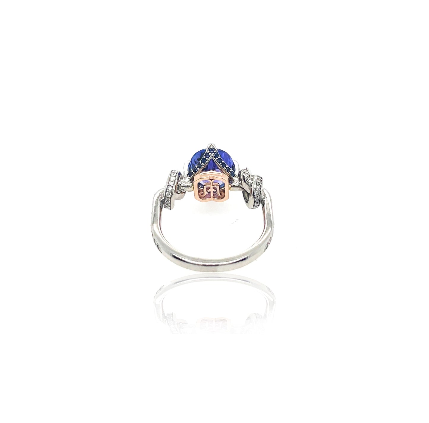 Pear Cut Tanzanite Forget Me Knot ring in platinum and rose gold