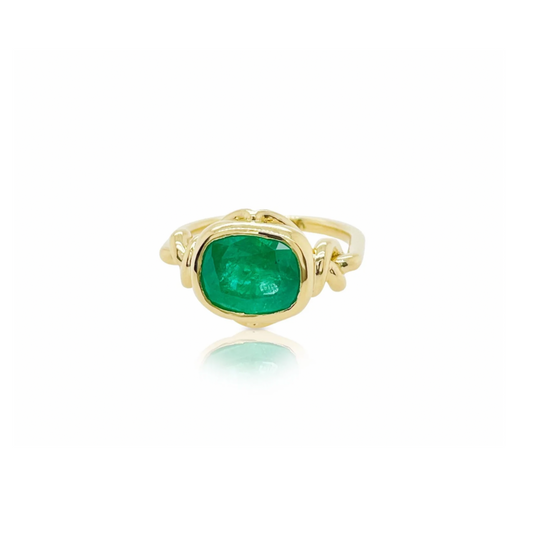 Forget Me Knot ring with Cushion Cut Emerald in 18ct yellow gold