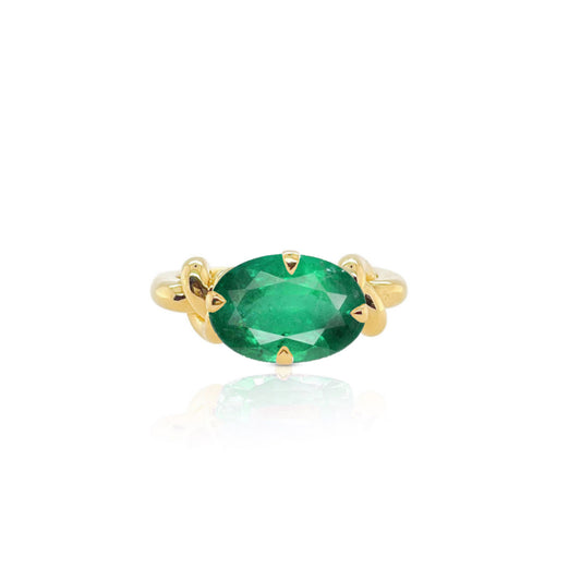 Forget Me Knot oval cut Emerald ring with petal basket in 18ct Gold